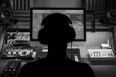 Man produce electronic music in studio